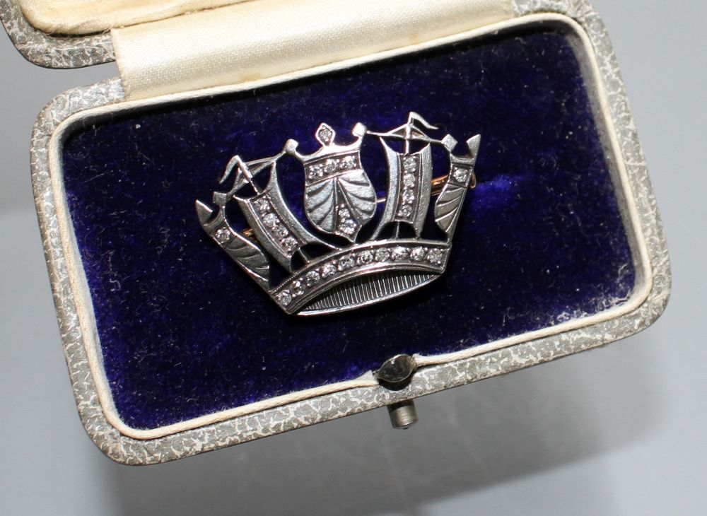 An early-mid 20th century white and yellow metal, diamond set naval coronet brooch, 28mm.